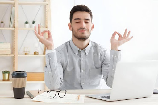 Professional taking a mindful break at work to boost productivity