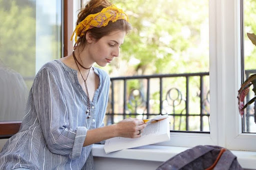 Person journaling to manage stress and maintain focus